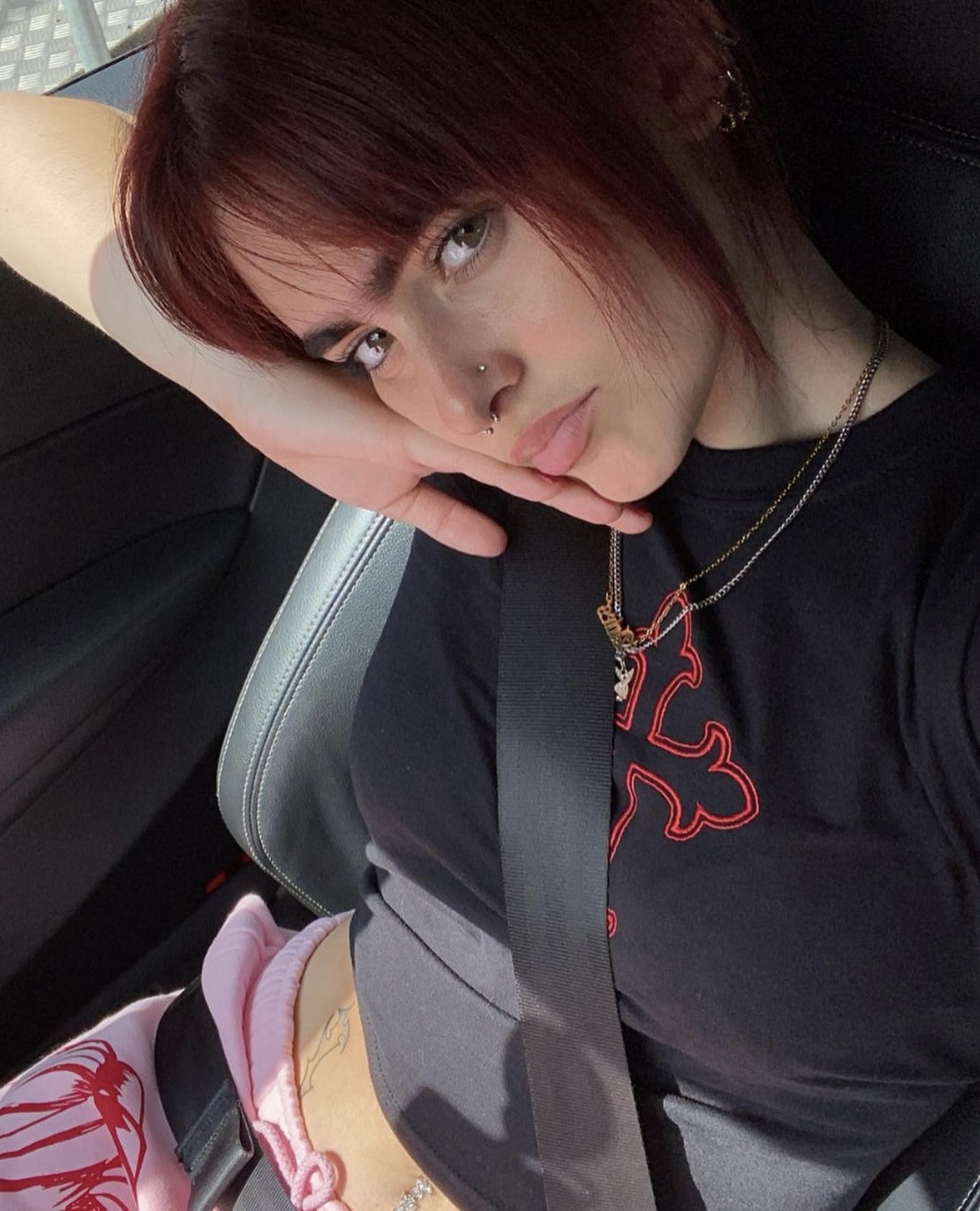Black embroidered tee worn off-duty